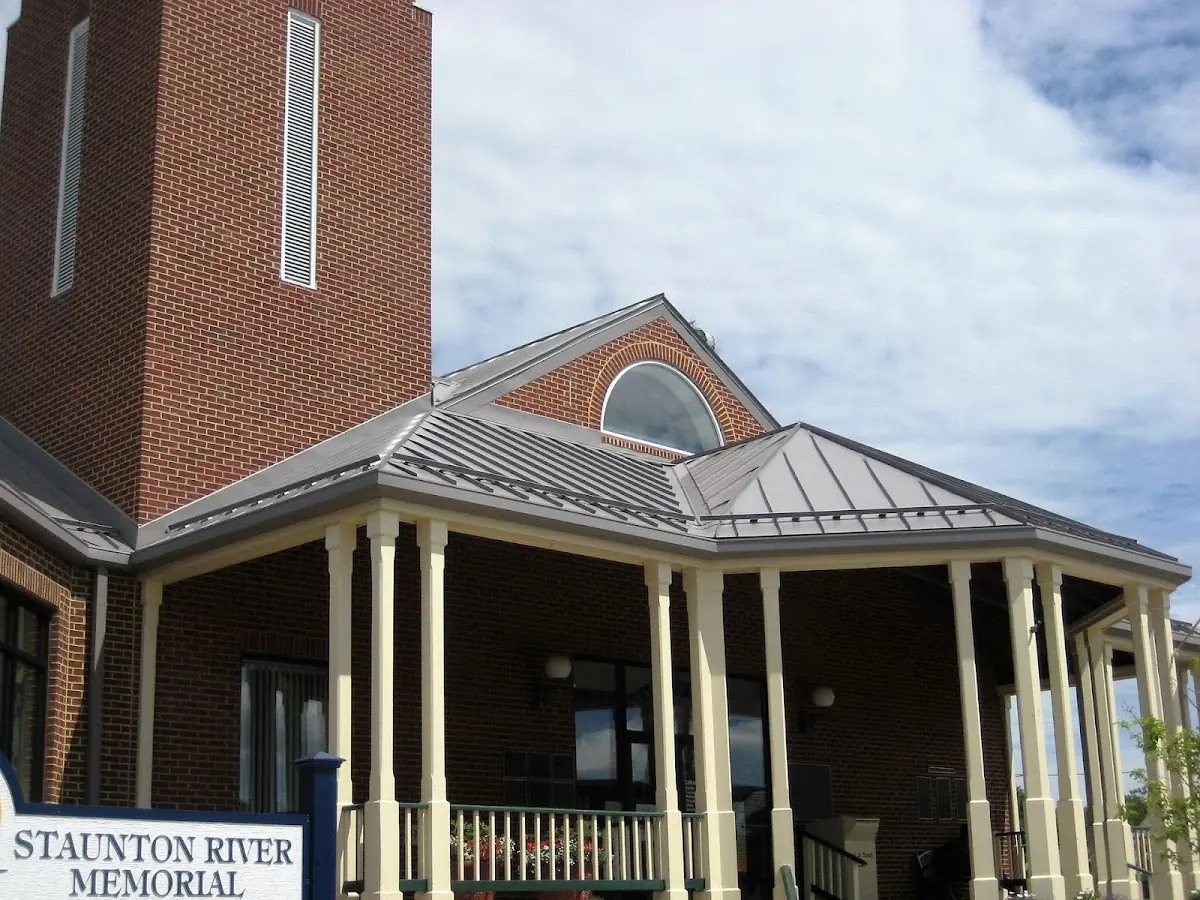 Skilled roofing craftsmen working on a residential roof in Caln Meeting House
